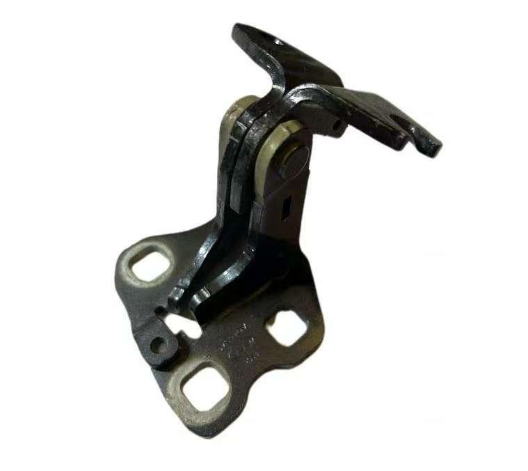 Under the hinge at the back-right