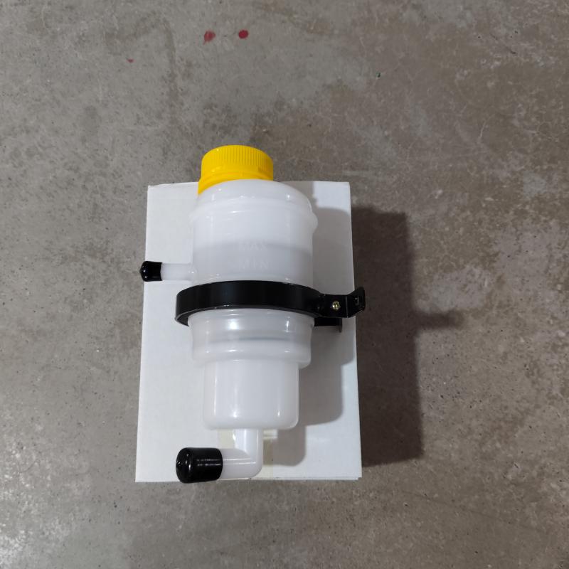 Power steering pump oil reservoir
