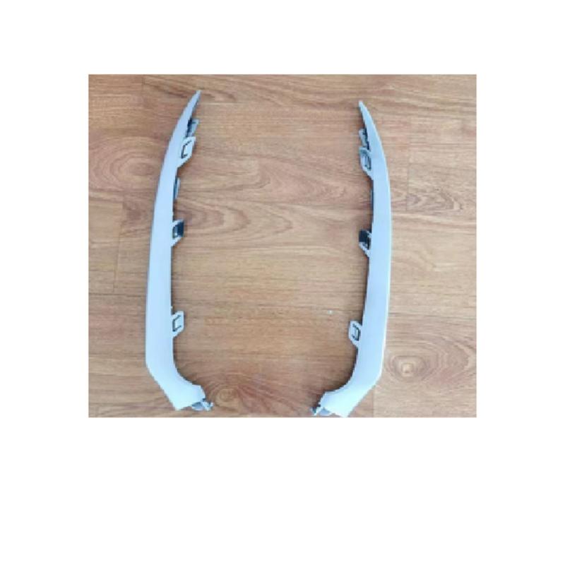 Front bumper trim strips, left and right (silver).