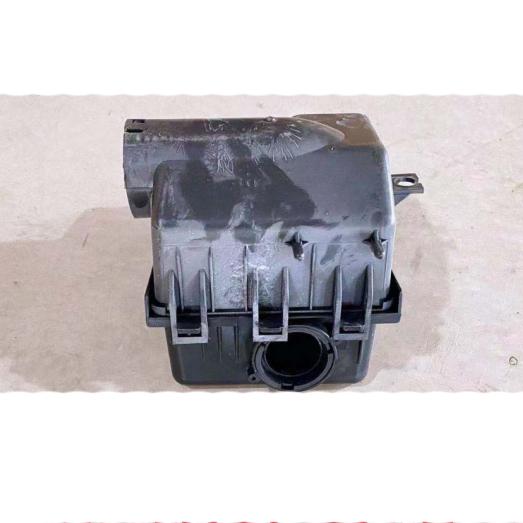 Round air filter housing.