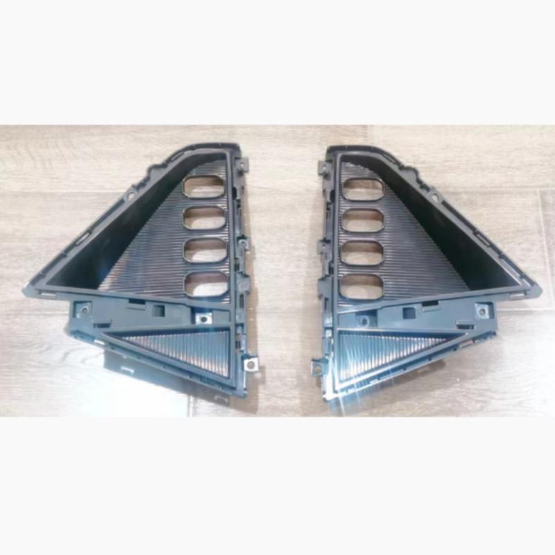 Front bumper fog light frame.