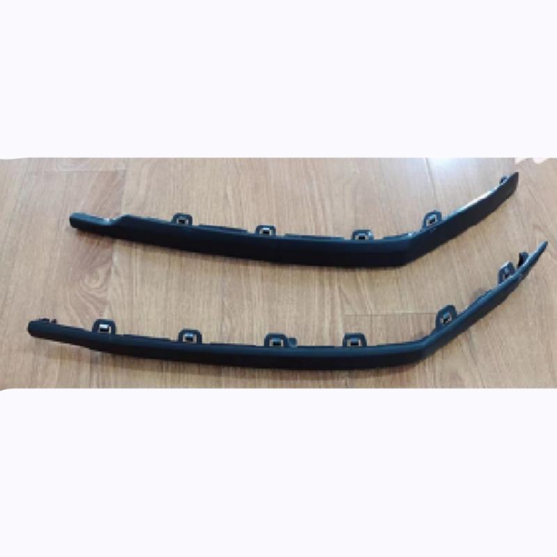Rear bumper rear fog light frame trim piece.